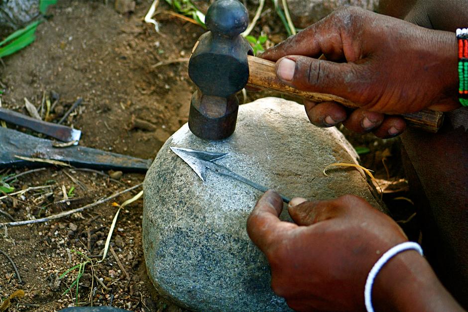 Metal from nails is hammered and shaped into arrow-heads, and the sap of the desert rose shrub used to coat the tips in poison.

Certain rules and beliefs govern Hadza hunting practices. If an animal is only wounded when shot, the name of the species may not be mentioned directly; in uttering its name, the Hadza believe that the animal would recover - and escape. 

