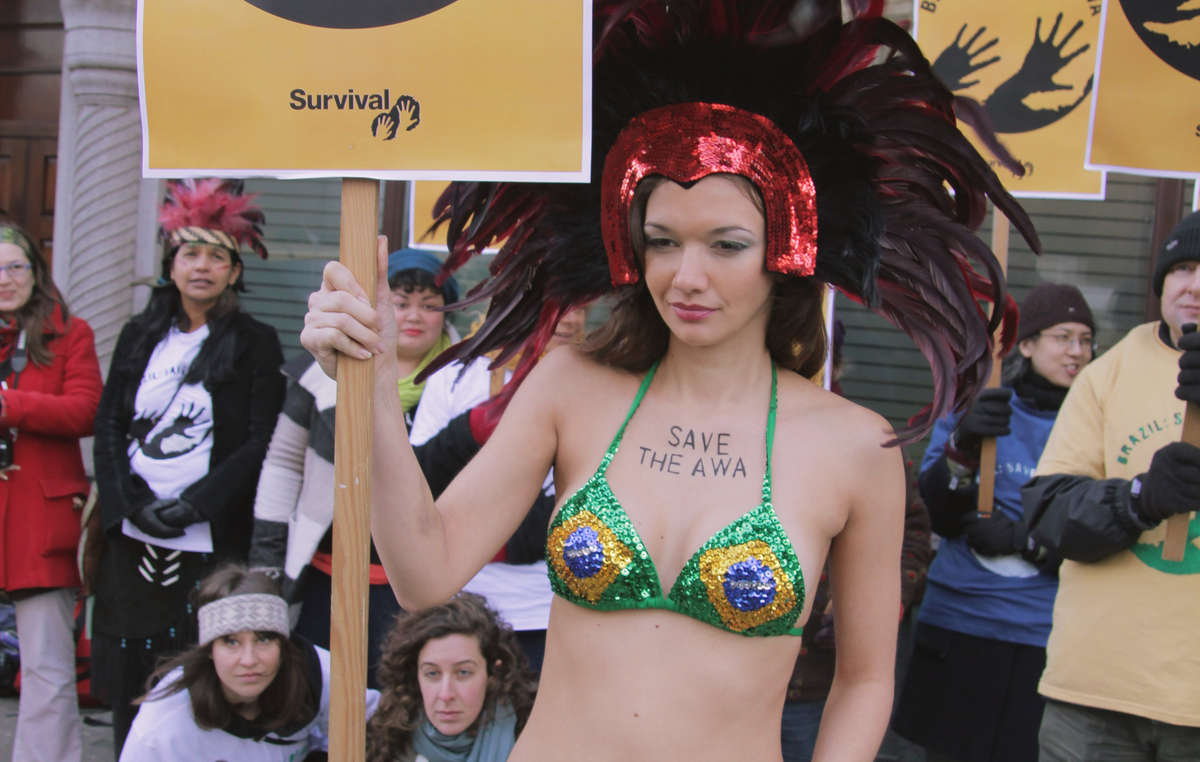 A London supporter in carnival costume carried a message for Brazil to 'Save the Awá'.
