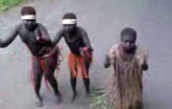 Still from video showing Jarawa girls forced to dance during a human safari.