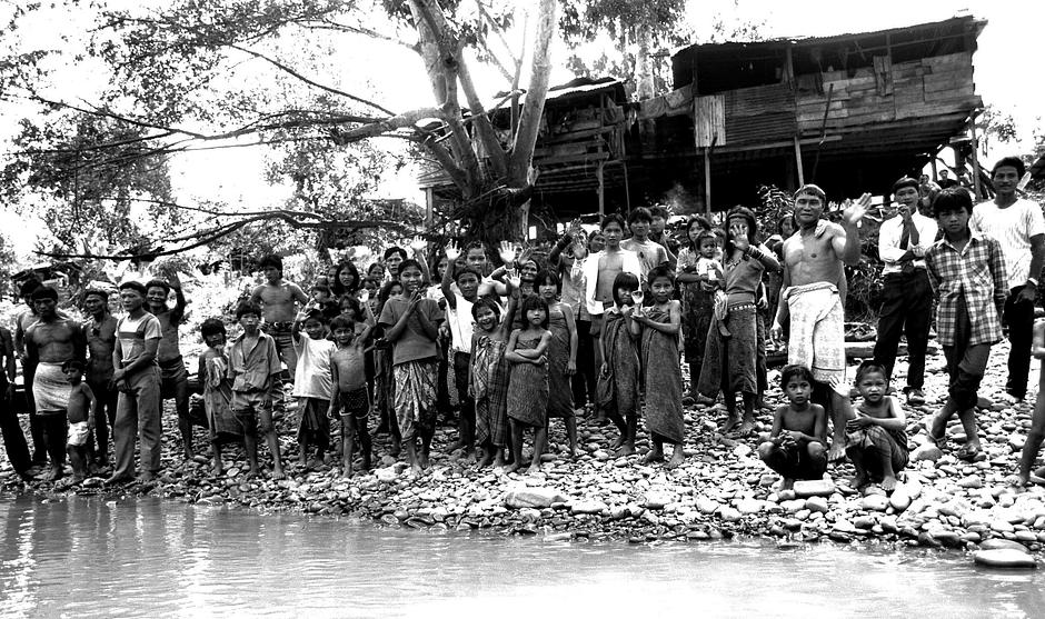 A Penan community in Sarawak, Malaysia.

Many tribal children have lived, and still live, in complex communities, where they grow up knowing a greater intimacy with a larger number of individuals, and people who look after them, than most city dwellers. 

Values have evolved that place the collective over the individual - many tribal children are taught that sharing is a fundamental tenet of social life, and community decisions are made by consensus.