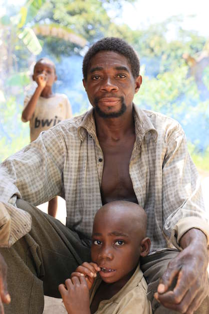 Father and son Mongemba and Indongo from the Ba'Aka 'Pygmy' tribe. 

Amongst the Ba'Aka, who live in the Republic of Congo and Central African Republic, fathers spend approximately half the day near their babies. They even offer them a nipple to suck if the child is crying and its mother - or another woman - is not available.

_It is not uncommon to wake in the night and hear a father singing to his child_, says Professor Barry Hewlett, an American anthropologist who lived with the Ba'Aka for years.

For decades Pygmies have been the victims of landgrabs in the name of conservation, as well suffering from the consequences of mining, logging and palm oil development. 

There are currently plans to mine iron ore in the Tridom region of the Congo basin. This will bring in railways and a huge influx of laborers, further destroying the livelihoods of thousands of Baka and Bakola Pygmies.