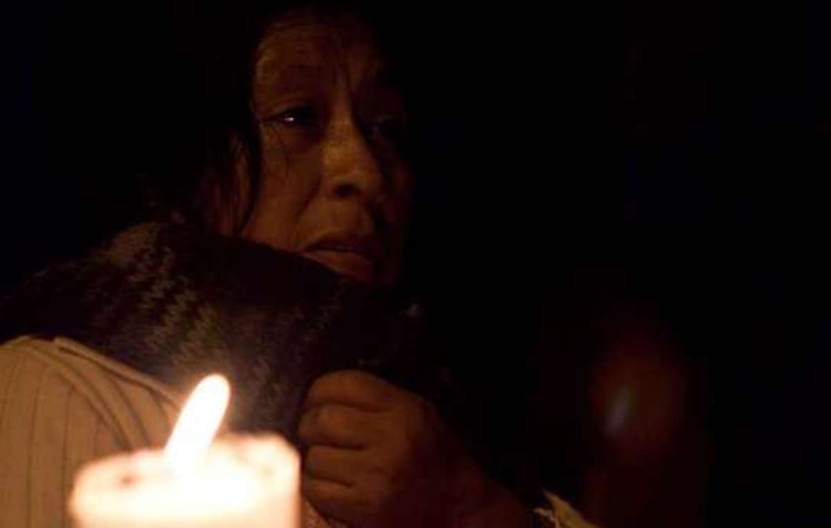 An Awá woman at a vigil for the twelve Awá massacred on 26 August 2009.