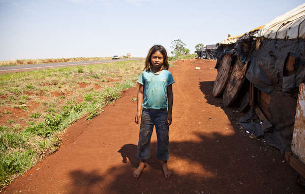 Many Guarani are forced to live in overcrowded reserves or in makeshift camps on the roadside following the theft of their land.