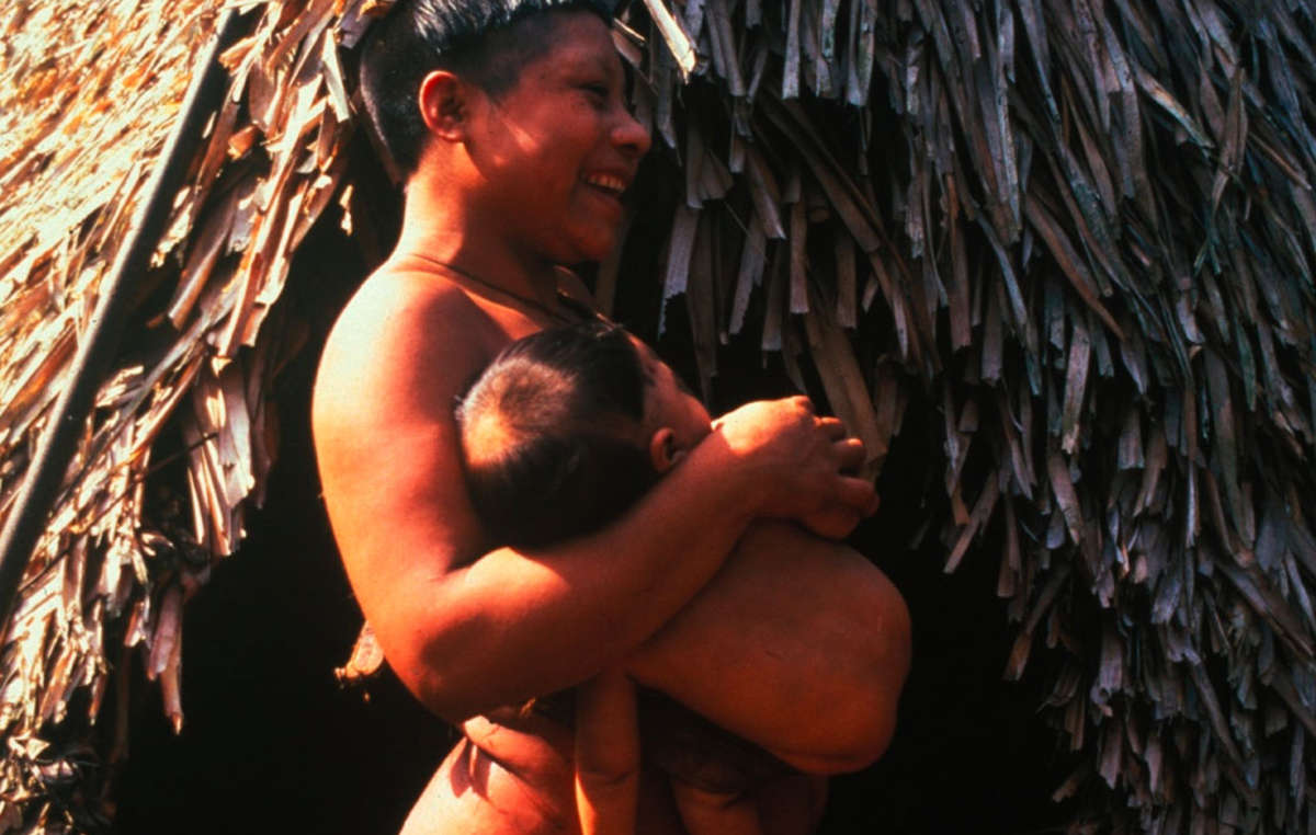 Korubo mother and child in the Javari Valley around the time of first contact in the mid nineties, Brazil. Located on the border of Brazil and Peru, the Javari Valley is home to seven contacted peoples and about seven uncontacted Indian groups, one of the largest concentrations of isolated peoples in Brazil.