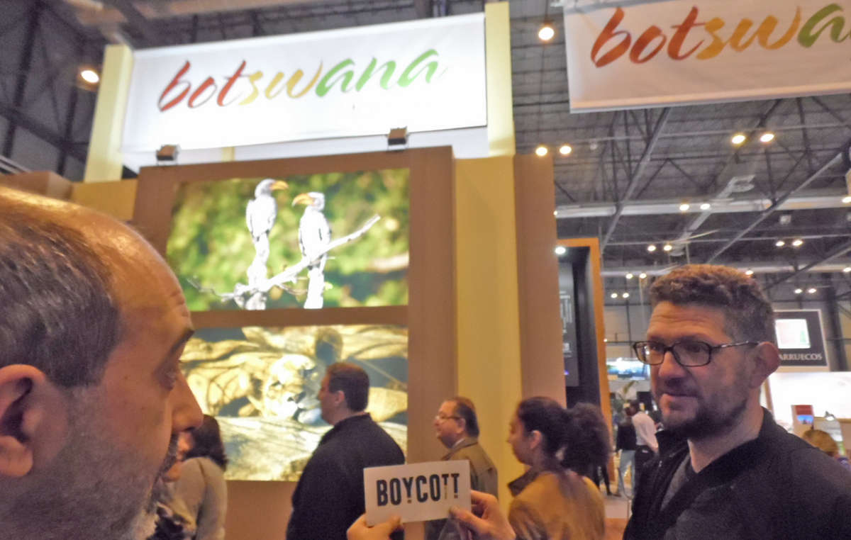 Protestors called on visitors at the Fitur travel fair in Madrid to support Survival’s tourism boycott