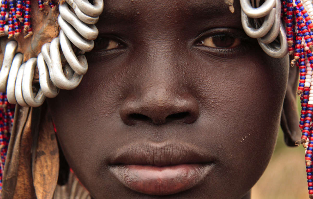 A girl from Ethiopia's Mursi tribe, which faces intimidation from Ethiopia's security forces