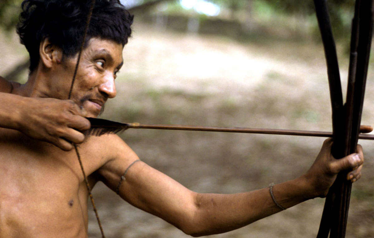 Awá man with bow and arrow, Posto Tiracambu, Caru, Brazil, 2000.