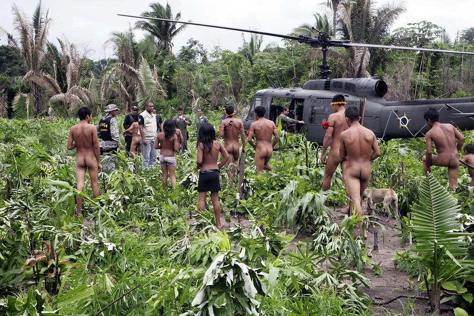 Members of the operation team update the Awá on progress in expelling the loggers. 

In April 2014, the tribe received an official document confirming that all non-Indians had been removed from their territory.

Survival’s Director, Stephen Corry, said, _The loggers' removal has halted the otherwise inevitable march towards the extinction of yet another American Indian tribe, at least for the moment.  It's unprecedented_.

_No other public campaign in history has pressed a government to act so quickly and decisively to stop a tribal people from being wiped out_.

Survival International is now calling on the Brazilian authorities to put in place a permanent land protection program, to keep invaders out of the Awá's territory for good.