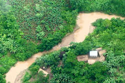 Illegal logging settlement inside the Murunahua Reserve for uncontacted tribes, south-east Peru.