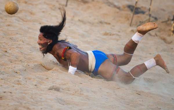 Enawene Nawe man playing head-football.