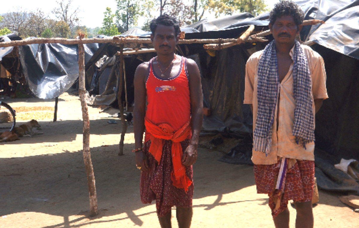 These Khadia men were thrown off their land after it was turned into a tiger reserve. They lived for months under plastic sheets. Millions more face this fate if the 30% plan goes ahead.