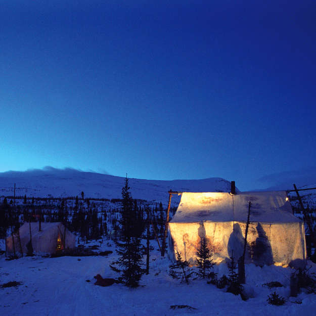 November 2015 - Innu tent, Lake Natuashish, Newfoundland and Labrador, Canada.

In Canada, in 1967, the Mushuau "Innu":http://www.survivalinternational.org/tribes/innu of Labrador were one of the last indigenous peoples to be forced to settle by the government. Many families still stay in the countryside - _Nutshimit_ - for severals months, hunting caribou, fishing, and picking berries whilst living in their tents.