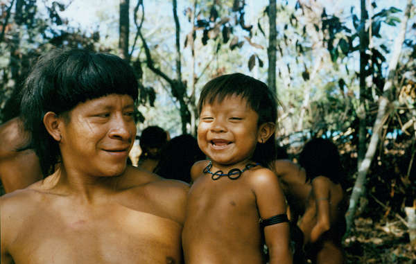 Enawene Nawe father and son, Brazil. The tribe opposes the building of 80 hydroelectric dams which would pollute the water and destroy the fish which are an essential part of their diet.